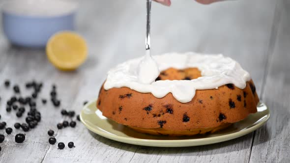 Homemade bundt cake with icing and black berries