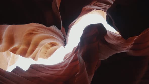 Beautiful Red Walls Smooth And Wave In Antelope Canyon To Background Sky