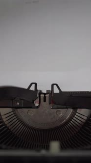 Written Charles Dickens on a White Paper with Vintage Typewriter