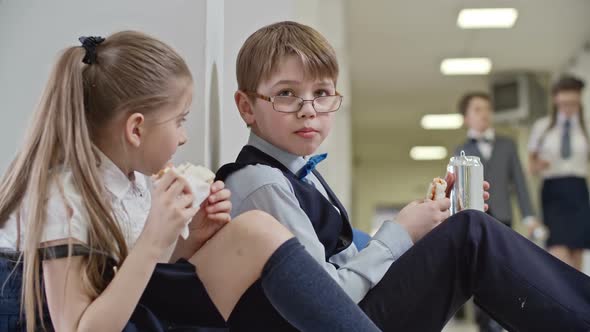 Schoolchildren Chatting on Lunch Break