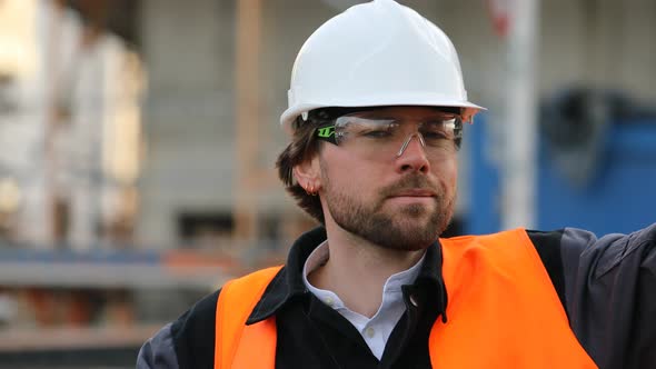 Portrait of smiling engineer wearing helmet