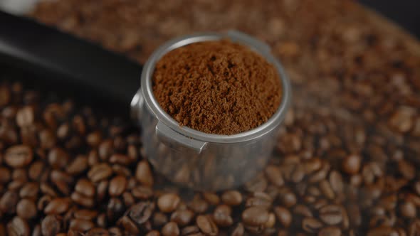 Ground Coffee in Portafilter on Wooden Board with Coffee Beans and Dissipating Steam