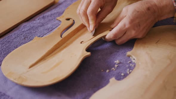 Female luthier at work in her workshop