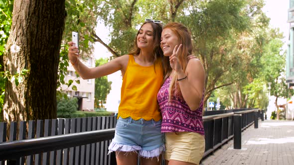 Teen Girls Taking Selfie By Smartphone in Summer