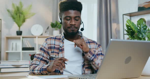 Man Having Video Call on Laptop, Woman Playing with kid