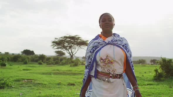 Maasai woman walking on a field