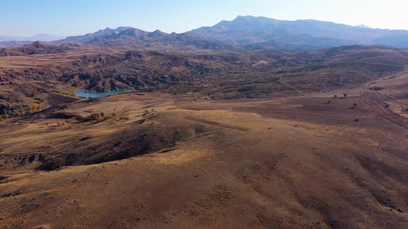 Scenic View of Brown Rolling Hills on a Sunny Day