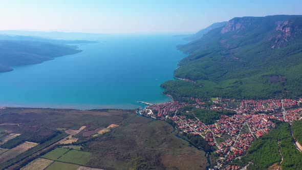 Top View to the Valley with City Buildings and Sea Between Mountains