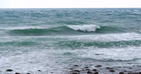 Sea waves rushing rocks