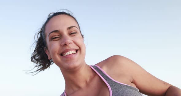 Young woman smiling in camera after yoga exercise outdoor - Sport exercises concept