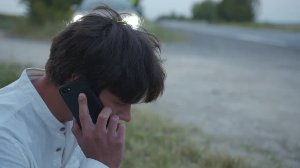 Close Up Man's Face That Waits on the Phone Line