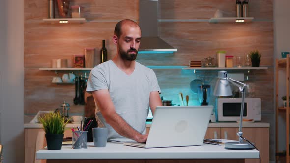 Business Man Working From Home Using Laptop