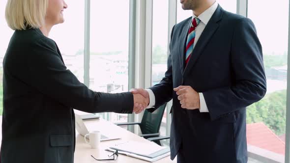 Business People Handshake with Friend at Office