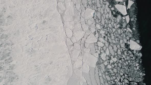 Conjunction of Frozen Ice Surface with Water in Winter