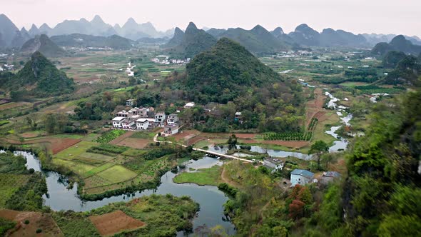 Aerial of the rock formations and towns along the Li River in China