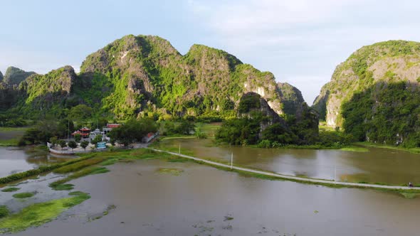 Aerial: North Vietnam karst landscape, drone view of Ninh Binh canyons and pinnacles