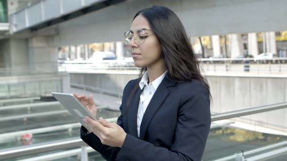 Focused Businesswoman with Tablet Pc Outdoors