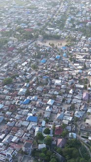 Zanzibar Tanzania  Aerial View of Houses Near the Coast Vertical Video