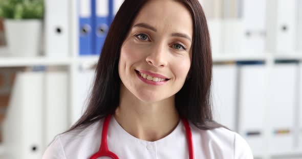 Portrait of Smiling Female Therapist in White Uniform in Clinic  Movie Slow Motion