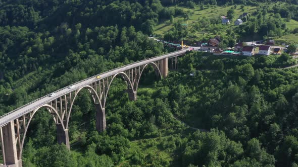 Old bridge and blue sea and traffic