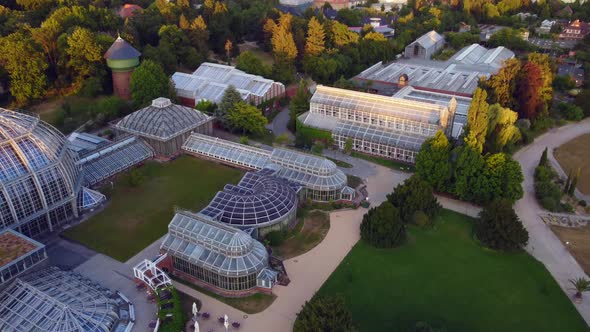 glasshouses greenhouses buildings.Breathtaking aerial view flight tracking shot from above drone fo