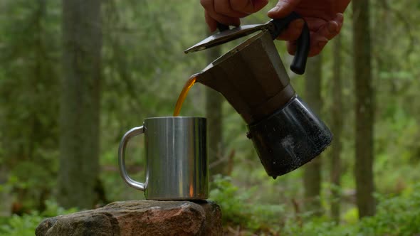 Coffee is Poured Into a Mug From a Coffee Maker