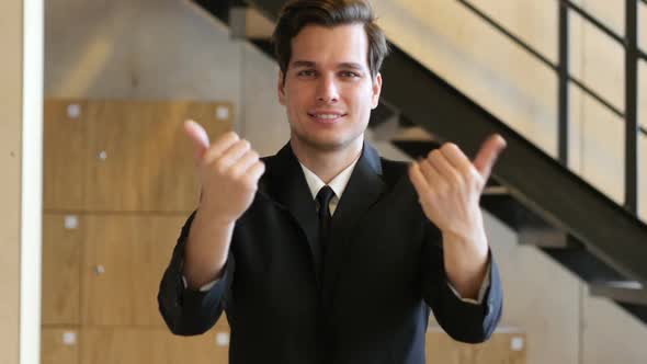 Inviting Gesture by Young Man in Suit