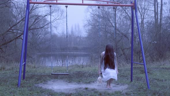 ghost of dead girl sways on children's swing 