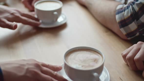 Barista Serving Coffee to Clients