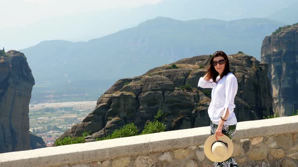 Young Woman Admires the Marvelous Mountains of Meteora, Greece, Wonderful Landscape.