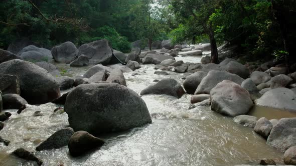 Drone flying along river just after Hin Lat waterfall, Samui Thailand