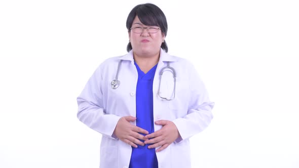 Stressed Overweight Asian Woman Doctor Having Stomachache