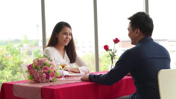 Happy Romantic Couple Eating Lunch at Restaurant