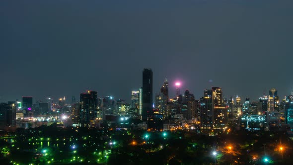 Time lapse night cityscape and high-rise buildings in metropolis city center