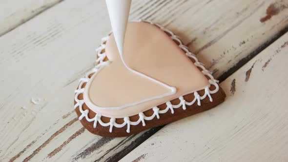 Decorating of Cookie with Pink Frosting