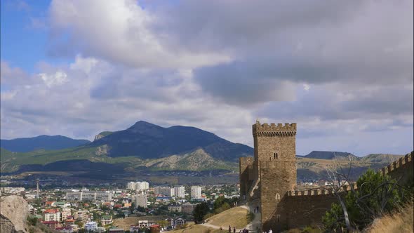 Mountains in the Blue Sky with White Clouds. The City Is Located in the Valley. Crowds of Tourists