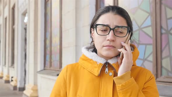 Upset Girl Talking on the Phone