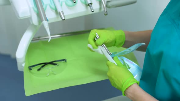 Assistant Unpacking Sterile Dental Tools, Hygiene, Trust Professional Services