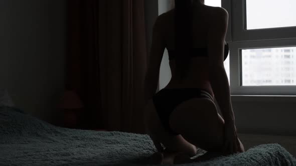 Woman in Black Lingerie Showing Body Shapes
