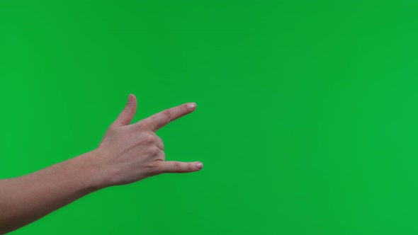 Female Hand Gesturing Heavy Metal Rock Sign Isolated Green Background
