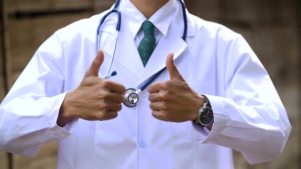 Doctor's Hands With Thumbs Up