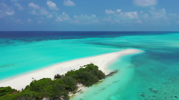 Beautiful overhead travel shot of a white sandy paradise beach and aqua turquoise water background i