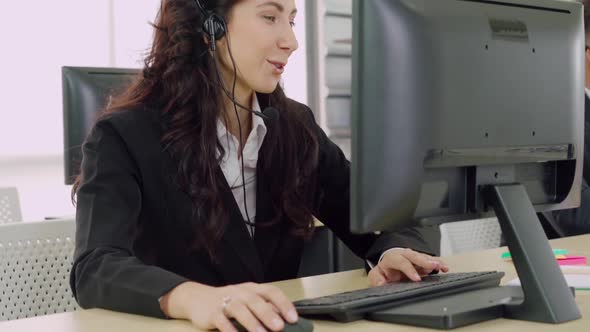 Business People Wearing Headset Working in Office