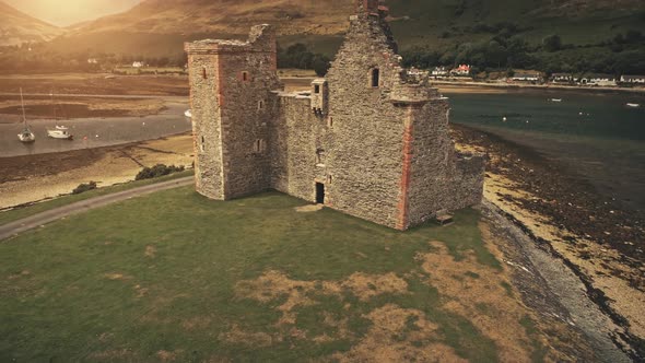 Closeup Castle Ruins at Sun Sea Coast Aerial