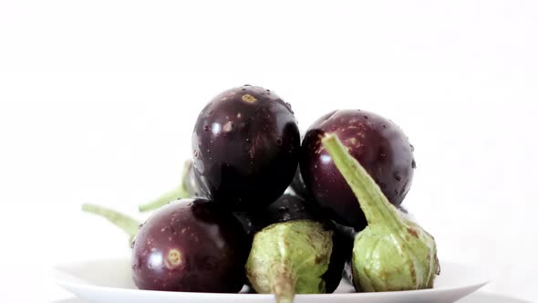 Eggplants On White Background Rotating