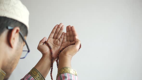 Muslim Man Keep Hand in Praying Gestures During Ramadan Close Up