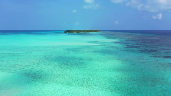 Luxury aerial copy space shot of a white paradise beach and blue sea background in 4K