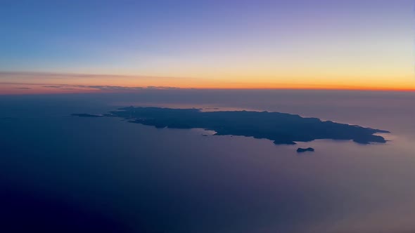 Aerial view of Ibiza Island, in Spain, during sunset, pilot point of view, from a jet cockpit 4K 60F