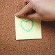 Person sticking a heart note on a cork board - VideoHive Item for Sale
