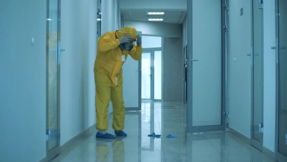 Paramedic Comes Out of the Room and Sits Down on the Floor